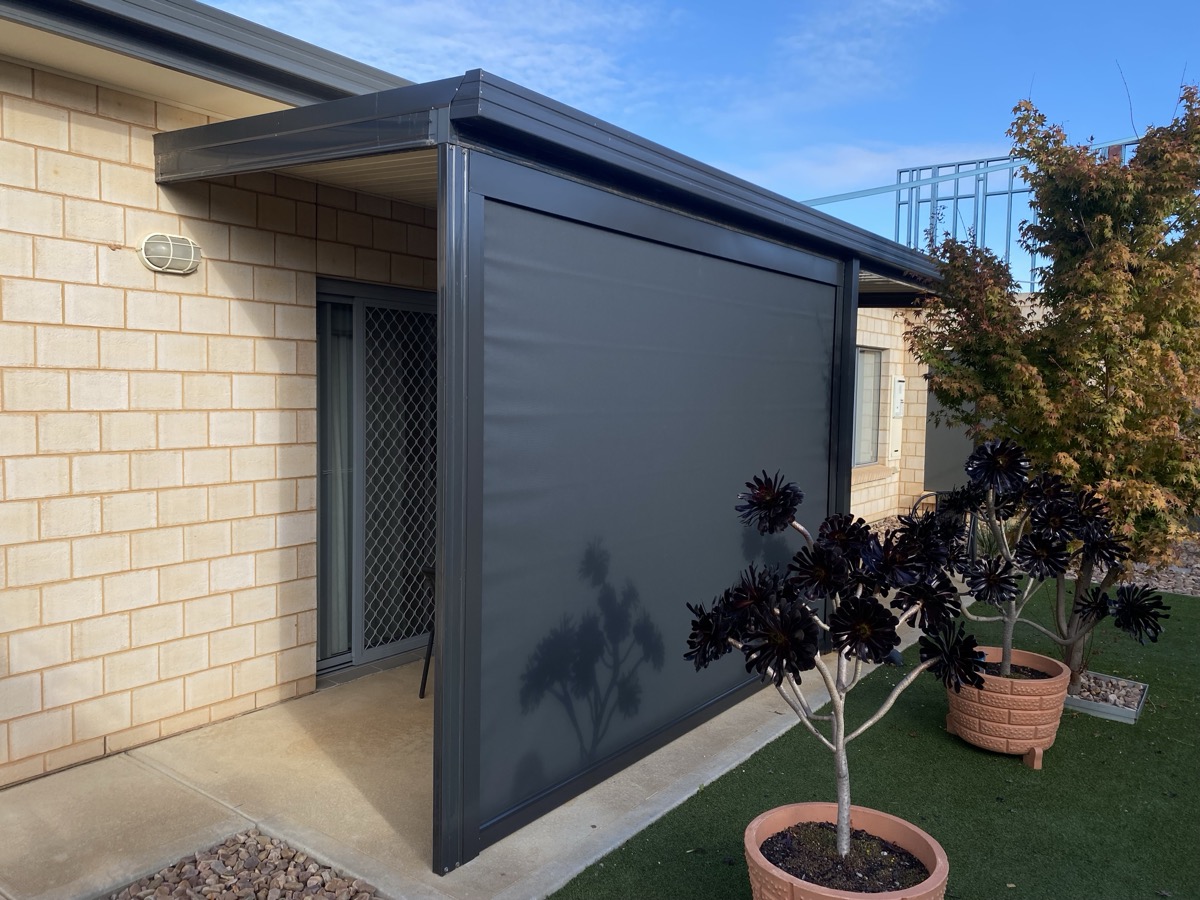 Dark outdoor blind limestone home