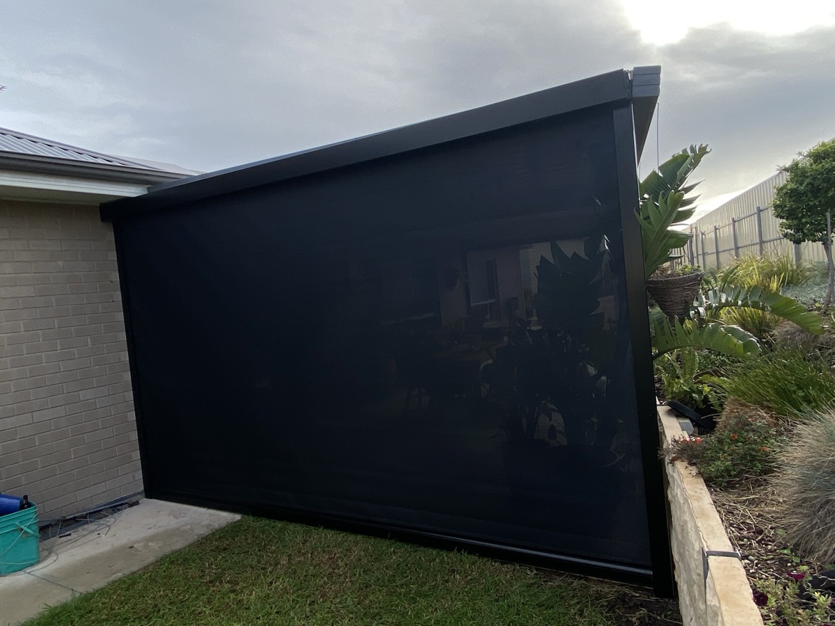 Black outdoor blind with garden